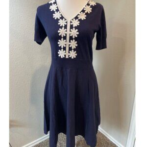 Draper James navy dress with white floral accents on the neckline